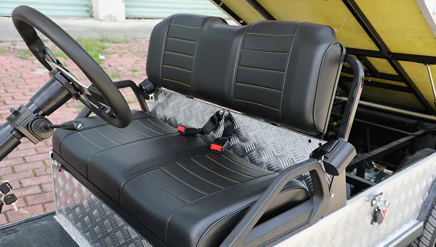 Luxury leather seats on Tara golf cart, with custom two-tone finish, contrast stitching, and enhanced comfort