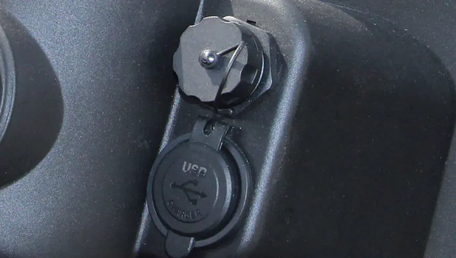 Close-up of USB charging port installed on Tara golf cart dashboard, enabling easy device charging on the go