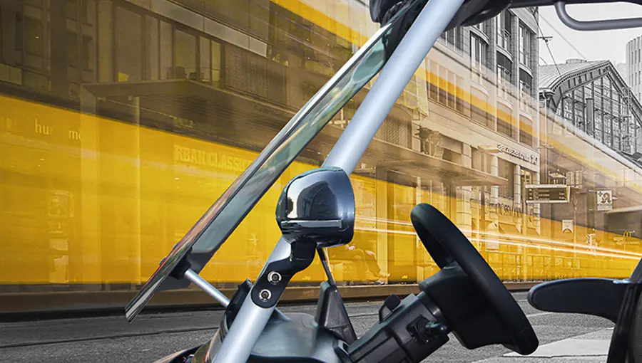 Close-up of Tara T3 2+2 golf cart front windshield made of high-quality, impact-resistant material for driver safety