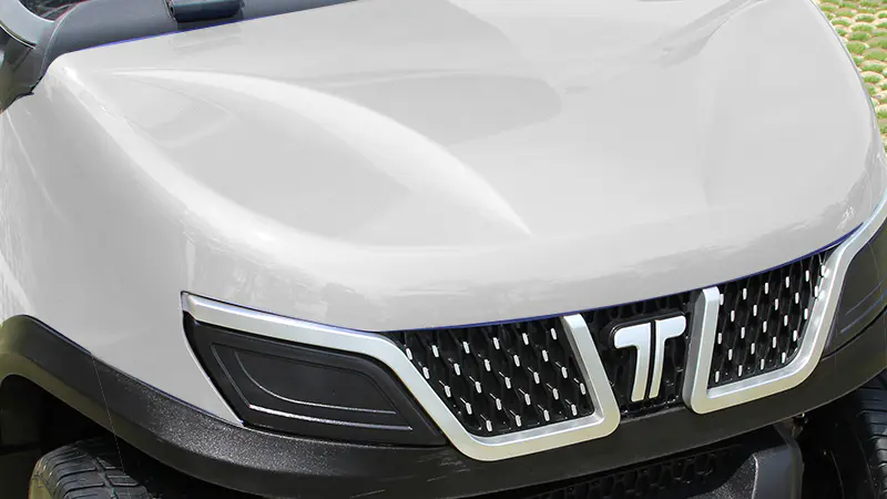 Close-up of Tara golf cart front end showcasing aerodynamic styling and sturdy construction for enhanced performance