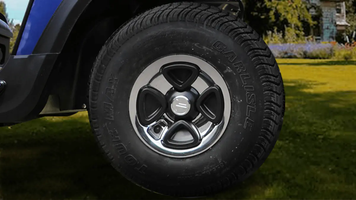 Close-up of Tara golf cart 12-inch aluminum wheel paired with a radial tire, offering strength and smooth ride performance