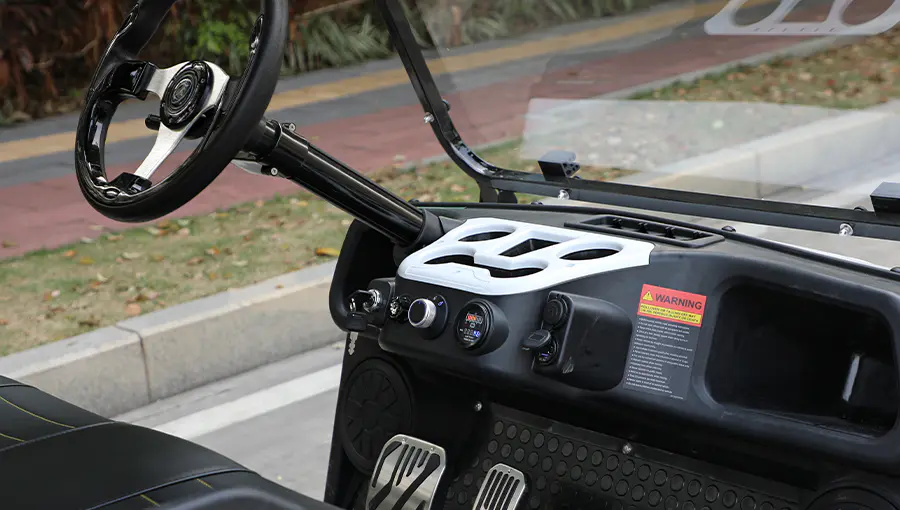 Close-up of Tara golf cart dashboard featuring digital speedometer, battery indicator, and control switches