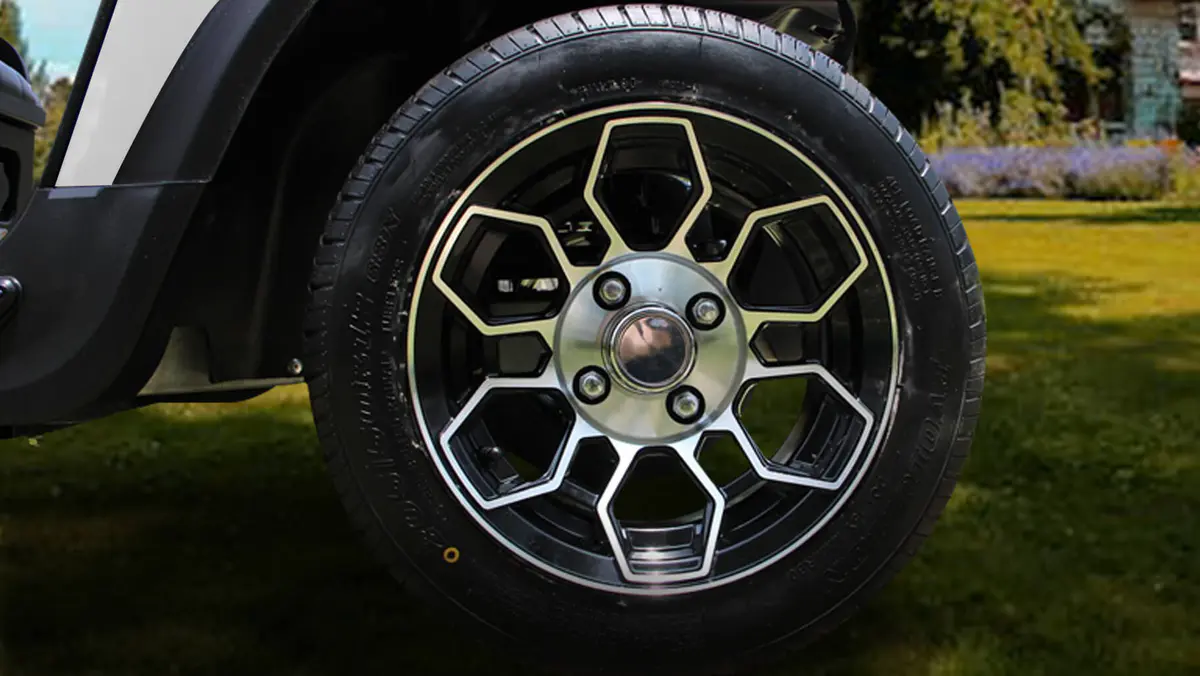 Tara golf cart featuring 12-inch tires ideal for various terrains, offering smooth and stable driving experience