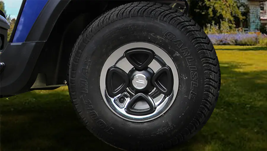 Close-up of 8-inch lawn tires on Tara golf cart, designed for optimal traction and minimal turf damage