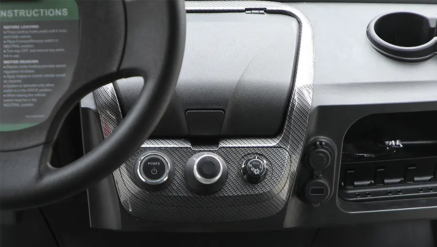 Interior view of Tara golf cart showing well-organized control switches within reach of the driver